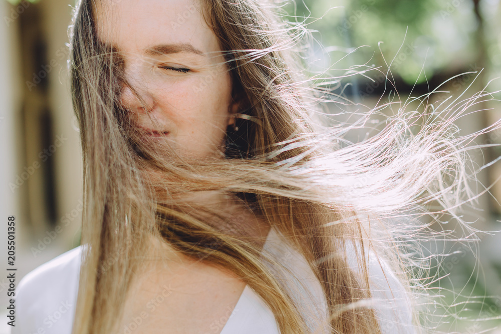 Wall mural portrait of happy beautiful woman with long hair, closeup