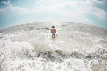 Woman bathing in the ocean.