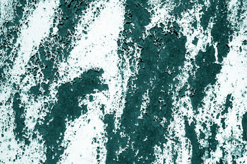 Grungy rusted metal surface in cyan tone.