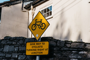 Yellow warning symbol in street of irish town