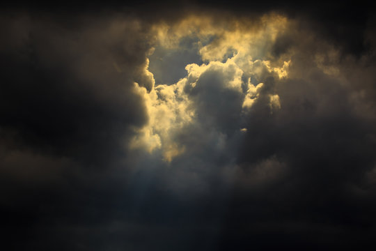 Light of sun from dark clouds like heaven.