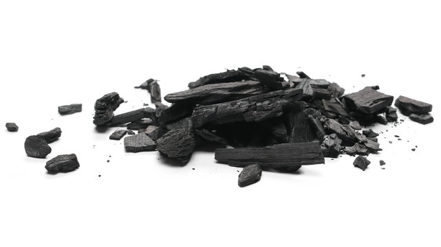 Charcoal pile isolated on white background