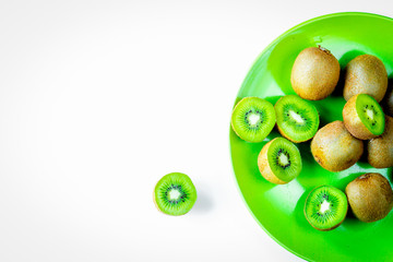 exotic fruit design with kiwi on plate on white background top v