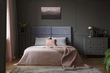 Pastel bedroom interior with painting