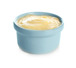 Tasty vanilla pudding in ramekin on white background