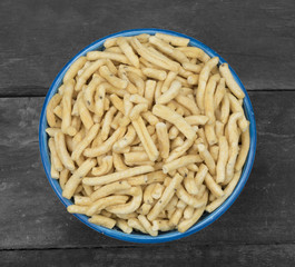 Indian Spicy Namkeen Food Ghatiya also know as Ganthiya or Gathiya are deep fried snack made from chickpea flour. They are a popular teatime snack in Gujarat