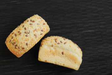 fresh mini bread on black wooden table