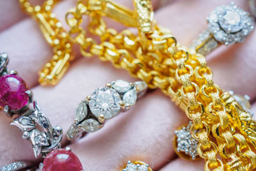 Gold and silver diamond gemstone ring necklaces and earrings in luxury jewelry box