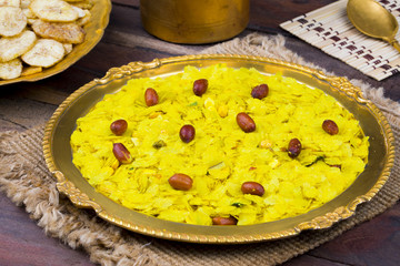 Indian Spicy And Crispy Popular Breakfast Poha Chivda Also Know as Poha, Chiwda, Chivada, Namkeen Crunchy Savory Snack on Wooden Background