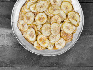 Banana Chips Popular Deep Fried Tea Time Snack on Dark Wooden Background