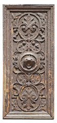 The wooden panel of the old shattered retro door is covered with cracked brown paint