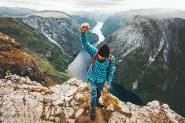 Happy Man traveling in Norway mountains  active lifestyle weekend getaway adventure vacations success winner concept aerial view landscape