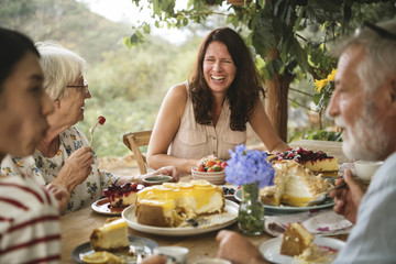 Friends enjoying dessert in the garden