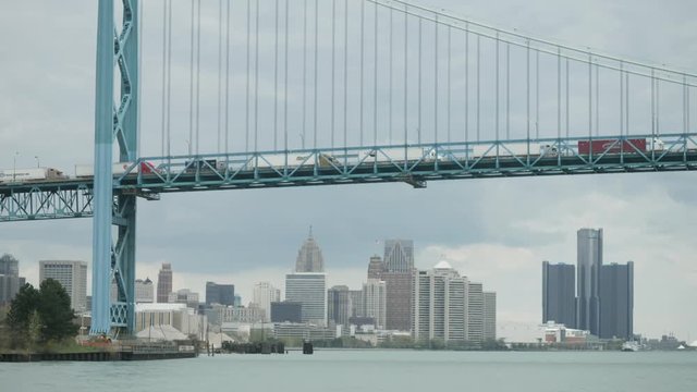 View of Ambassador Bridge over the Detroit river with downtown Detroit in the background