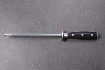 knife sharpener on a slate board with copy space