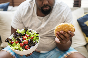 Man eating a big hamburger