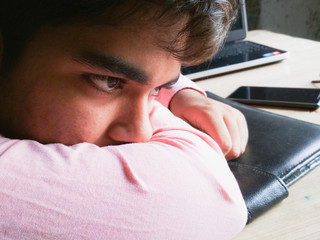 Young boy in deep thinking