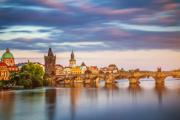 Charles Bridge (Karluv Most) and Lesser Town Tower, Prague in summer at sunset, Czech Republic