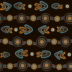 Australian aboriginal seamless vector pattern with dotted circles, rings, boomerangs and wavy stripes