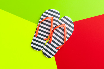 Female flip flops on a colorful vibrant background