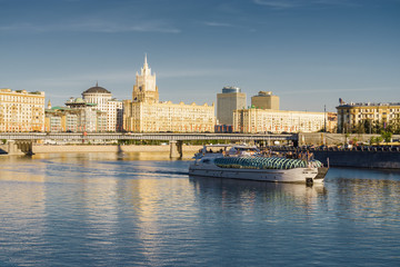 Fototapeta premium Sunny view of Smolenskaya embankment and Moskva river, Moscow, Russia.
