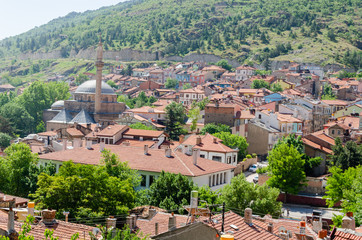 With houses with wooden shutters in the classic Turkish Ottoman style and mosque,  top view. Afyonkarahisar in Turkey,