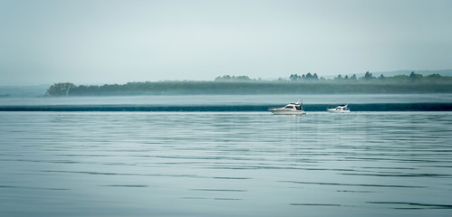 Boats in foggy scenery