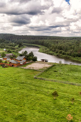 View from the helicopter to the village near the river