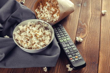 Salt popcorn on the wooden table