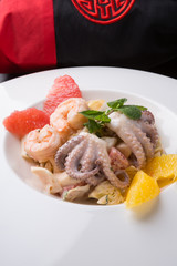 Seafood salad served with grapefruit