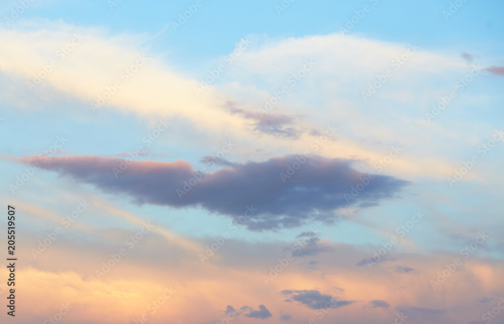 Wall mural quaint clouds in the sky before sunset.