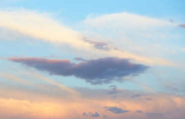 Naklejka na ściany i meble quaint clouds in the sky before sunset.