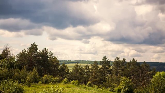 Quickly floating white clouds in cloudy day