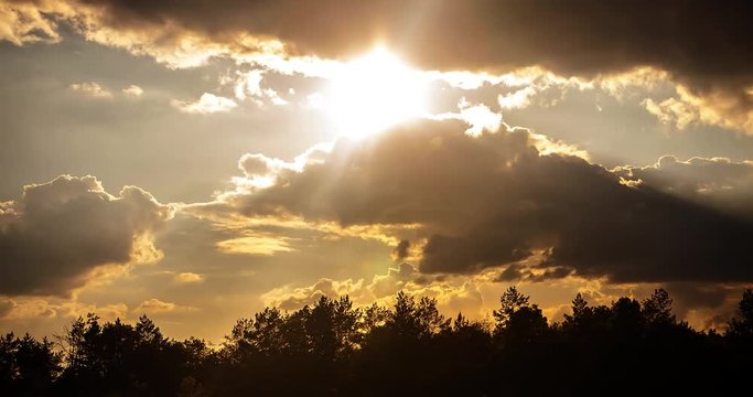 Quickly floating dark clouds in cloudy twilight and sunset