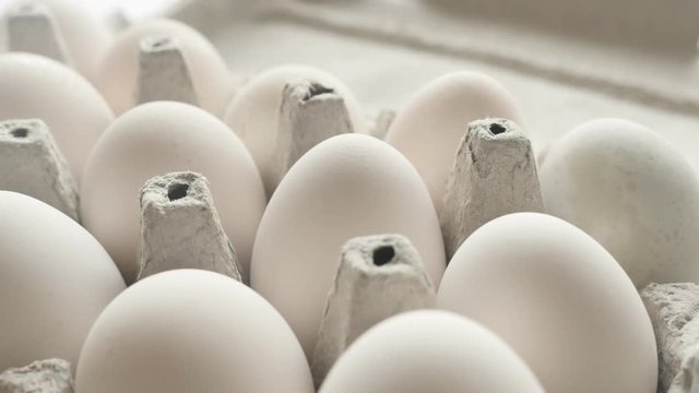 Package of chicken eggs close-up 4K footage