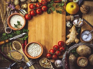 products for cooking, vegetables, ingredients, spices. place for text. wooden plank. food background.