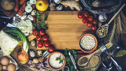 products for cooking, vegetables, ingredients, spices. place for text. wooden plank. food background.
