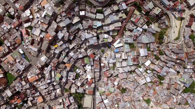Top view of overpopulated area Comuna 13 in Medellin, Colombia, once considered one of the most dangerous neighbourhoods in the world.