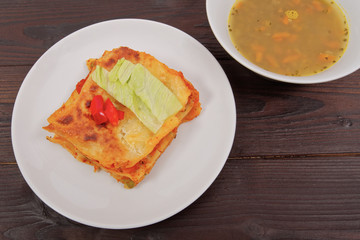 Lasagna with vegetables on a table