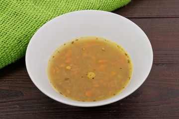 Lentil soup with carrots on a table