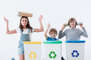 Happy children segregating household waste