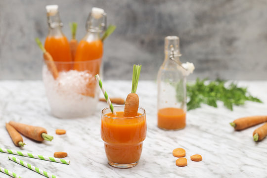 Refreshing carrot juice on marble