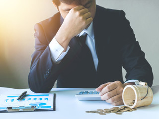 Businessman feeling stress from work loss
