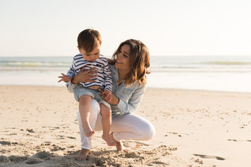 Mother at the beach with her baby