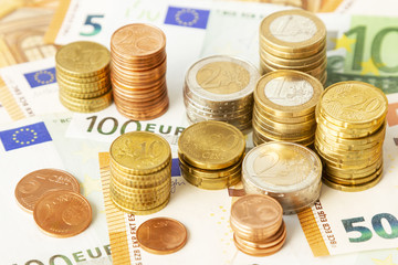 Stack of euro coins on euro banknotes, for backgrounds. Germany