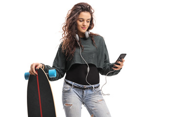 Skater girl with a longboard using a phone © Ljupco Smokovski