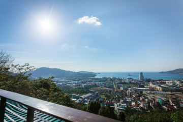 Fototapeta na wymiar Patong cityscape viewpoint from restaurant above the city with sunshine in the morning