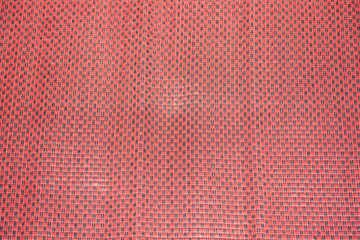 Patterns knit on the red mat.