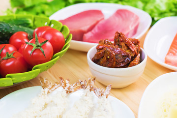 A close-up of the ingredients for the preparation of Caesar salad related to the kitchen. Home kitchen. Useful and tasty food