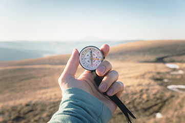 Compass in Hand Natural background .Vintage Tone